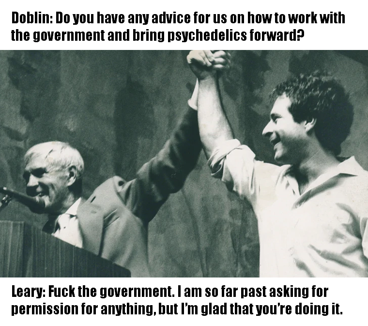 This meme is a humorous image featuring a photo of two people, likely politicians or leaders, shaking hands or standing together. The text above the image reads: "Doblin: Do you have any advice for us on how to work with the government and bring psychedelics forward?" and below it: "Lewey: F**k the government. I am so far past asking for permission for anything, but I'm glad you're doing it."